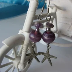 Online Che Carino Art Pendientes estrella de mar con amatista