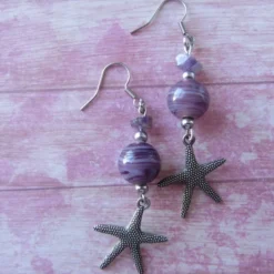 Online Che Carino Art Pendientes estrella de mar con amatista